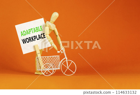 Adaptable workplace symbol. Concept words Adaptable workplace on beautiful white paper on wooden clothespin. Beautiful orange background. Bike model. Business Adaptable workplace concept. Copy space. Adaptable workplace symbol. Concept words Adaptable workplace on beautiful white paper on wooden clothespin. Beautiful orange background. Bike model. Business Adaptable workplace concept. Copy space. 114633132