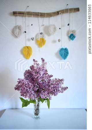 a bouquet of lilacs in a crystal vase in the interior a bouquet of lilacs in a crystal vase in the interior 114633665