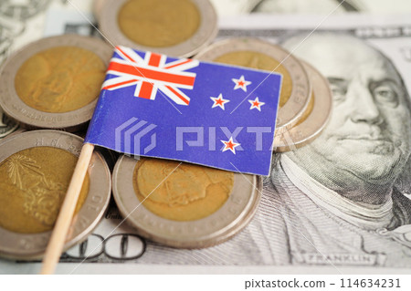 New Zealand flag on coin and banknote money, finance trading investment business currency concept. New Zealand flag on coin and banknote money, finance trading investment business currency concept. 114634231