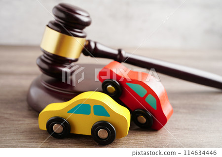Car accident lawsuit and insurance, Judge hammer with car model. Car accident lawsuit and insurance, Judge hammer with car model. 114634446