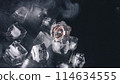 frozen rings in ice with water and smoke on black background	 114634555