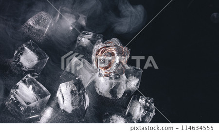 frozen rings in ice with water and smoke on black background	 frozen rings in ice with water and smoke on black background	 114634555