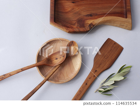 Wooden kitchen utensils stacked view, spoon and spatula close up Wooden kitchen utensils stacked view, spoon and spatula close up 114635534