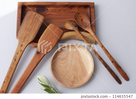 Wooden kitchen utensils stacked view, spoon and spatula close up Wooden kitchen utensils stacked view, spoon and spatula close up 114635547