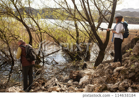 senior friends tourists outdoor adventure together on mediterranian sea landscape 114638184