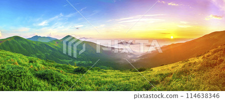 Beautiful sunrise in mountains with white fog below panorama 114638346