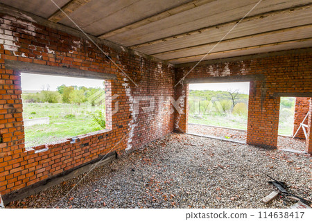 Interior of an old building under construction. Orange brick walls in a new house. 114638417