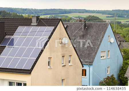 Renewable clean green energy saving efficient solar panels on suburban house roof. 114638435