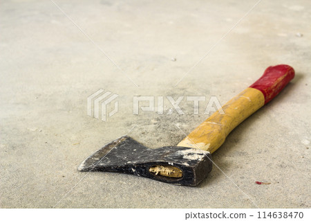 Old iron axe with wooden red and yellow handle isolated on white background. Handwork, labour and construction concept. 114638470