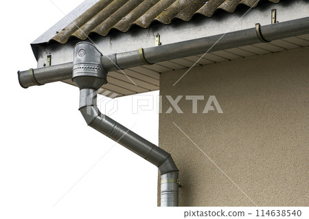 Corner of a house with a steel gutter system 114638540