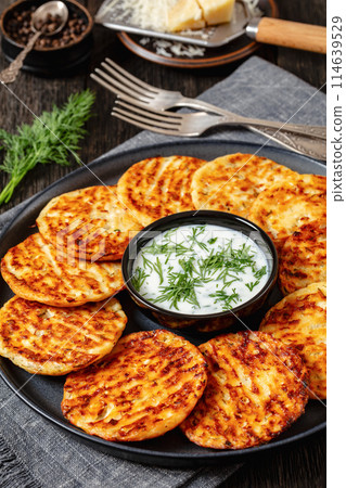 baked cottage cheese parmesan pancakes on plate 114639529