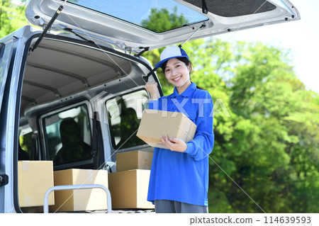 A delivery driver woman doing a fist pump A delivery driver woman doing a fist pump 114639593