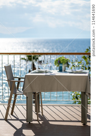 Restaurant table with sea view Restaurant table with sea view 114641690