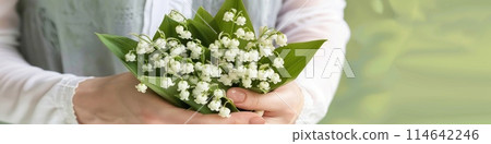 a bouquet of lilies of the valley cradled in gentle woman hands a bouquet of lilies of the valley cradled in gentle woman hands 114642246