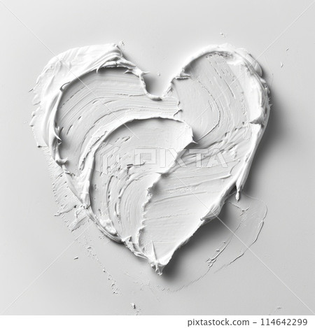 A heart-shaped smear of cream on a soft pastel background 114642299
