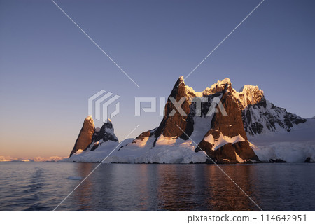 Lemaire strait coastal landscape, mountains and icebergs, Antarctic Peninsula, Antartica. Lemaire strait coastal landscape, mountains and icebergs, Antarctic Peninsula, Antartica. 114642951