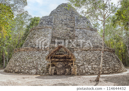 Coba, Mexico. Ancient mayan city in Mexico. Coba is an archaeological area and a famous landmark of Yucatan Peninsula. Cloudy sky over a pyramid in Mexico 114644432