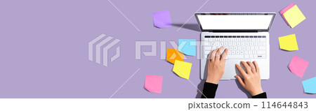 Laptop computer with many sticky notes Laptop computer with many sticky notes 114644843