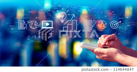 Content marketing concept with person using a smartphone at night 114644847