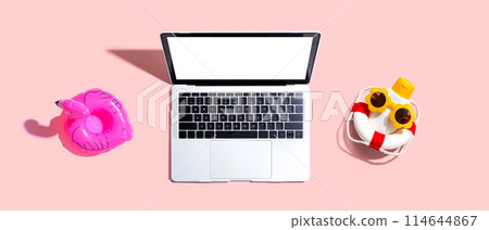 Laptop computer with summer theme items Laptop computer with summer theme items 114644867