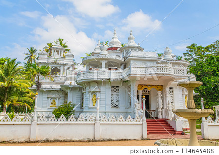 white multi-tiered building old construction, looks lacy. White Buddhist temple white multi-tiered building old construction, looks lacy. White Buddhist temple 114645488