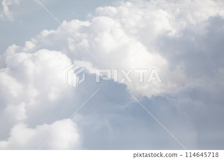 Sunrise above textured clouds from airplane window 114645718