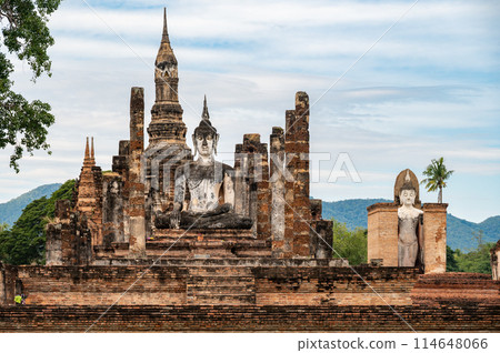 View of Wat Mahathat temple the most important and impressive temple compound in Sukhothai Historical Park. View of Wat Mahathat temple the most important and impressive temple compound in Sukhothai Historical Park. 114648066