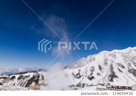 Aerial view of mountain hut and Mount Tsurugi from above Murododaira in early winter. Tateyama mountain range, Mount Tsurugi 114650438