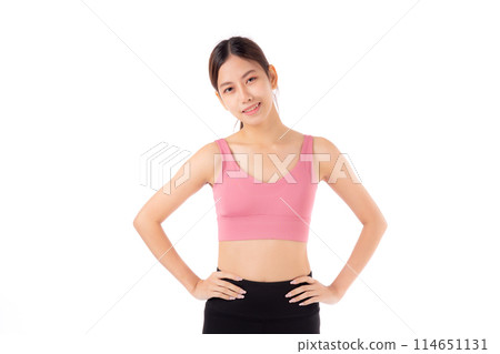 Portrait of beautiful young asian woman in sportswear smile and showing waist and abs isolated. 114651131