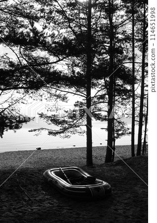 Rubber boat on lake shore. Rubber boat on lake shore. 114651998