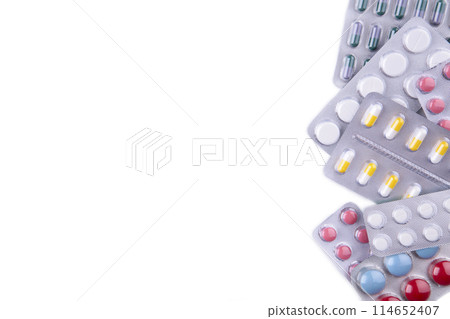 White pills in blister isolated on white background White pills in blister isolated on white background 114652407