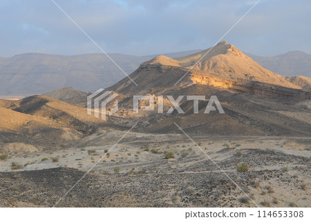 Desert landscape at sunrise. Hiking desert part of Israel National Trail. Negev desert . Valley. Colorful sands 114653308