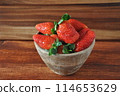 Sweet fresh strawberries on wooden table 114653629