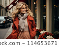 Stylish woman with shopping bags walking on city street, trendy urban fashion shopper 114653671