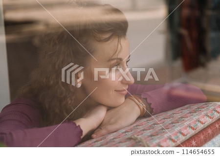 Stylish woman with curly hair in craft textile store, design concept Stylish woman with curly hair in craft textile store, design concept 114654655