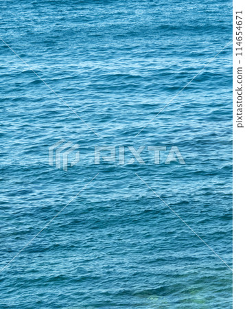 Vertical dark blue sea ripples background Vertical dark blue sea ripples background 114654671