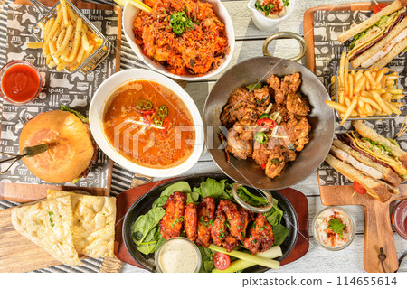 An assortment of delicious, nutritious food and vegetables in high-angle view. An assortment of delicious, nutritious food and vegetables in high-angle view. 114655614