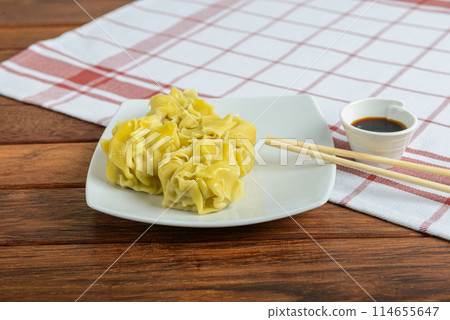 Dim Sims are Australian-Chinese dumplings, typically filled with pork or chicken and vegetables, then steamed or fried 114655647