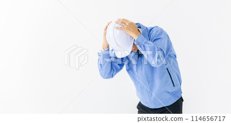 Man in work clothes, helmet, lament Man in work clothes, helmet, lament 114656717