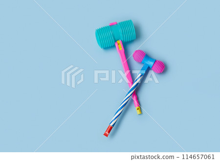 Toy hammer on a blue background for summer festival in June San Juan, Portugal Toy hammer on a blue background for summer festival in June San Juan, Portugal 114657061