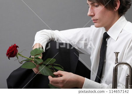 Portrait young man and rose enamoured love Portrait young man and rose enamoured love 114657142