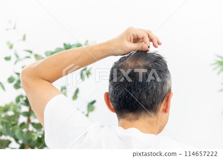 Middle-aged man, hair care, back view Middle-aged man, hair care, back view 114657222