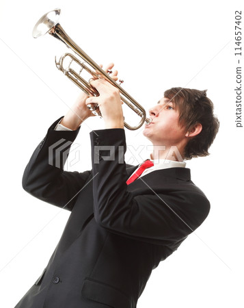 Portrait of a young man playing his Trumpet 114657402