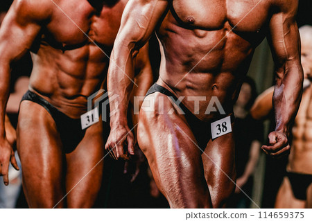 group bodybuilder athlete show pose for bodybuilding competition group bodybuilder athlete show pose for bodybuilding competition 114659375