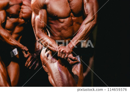 bodybuilding competition man athlete show side chest pose bodybuilding competition man athlete show side chest pose 114659376