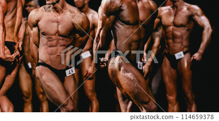 group bodybuilder athlete show side triceps pose for bodybuilding competition 114659378