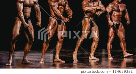 group bodybuilder athlete show pose for bodybuilding competition on black background 114659381