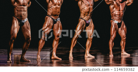 group bodybuilder athlete show abdominals and thigh pose for bodybuilding competition group bodybuilder athlete show abdominals and thigh pose for bodybuilding competition 114659382