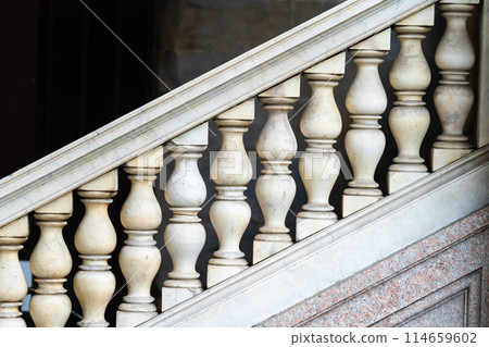 closeup of ornate stone staircase balusters 114659602