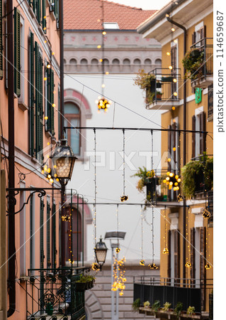festive lights on narrow european street festive lights on narrow european street 114659687